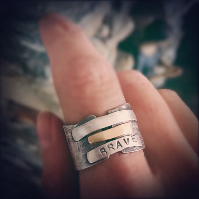 Silver and gold *brave* ring